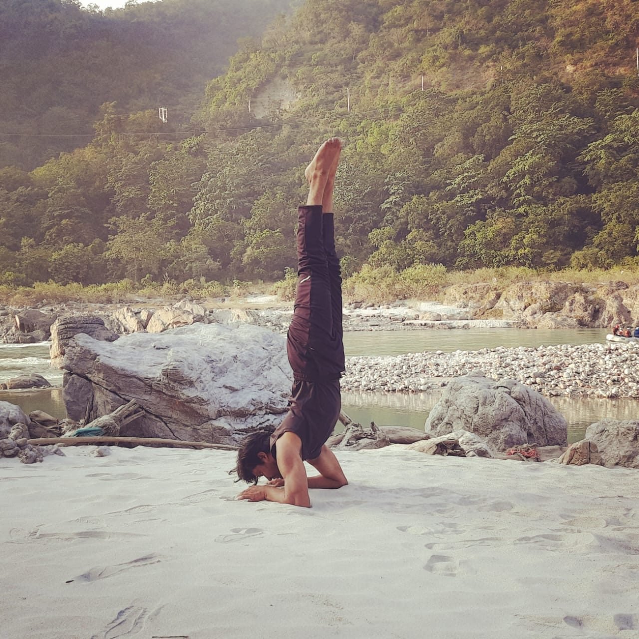 Yogi Gajendra holding a steady headstand during outdoor practice