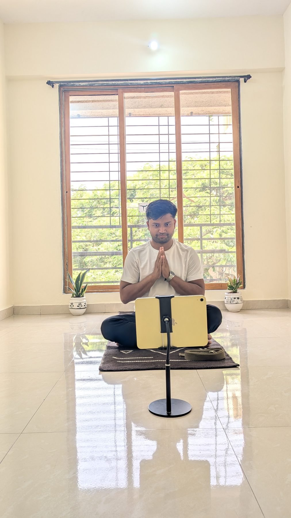 Yogi Gajendra greeting a student with namaste at the start of a live online session