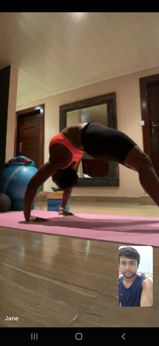 A student practising a backbend during a live guided session